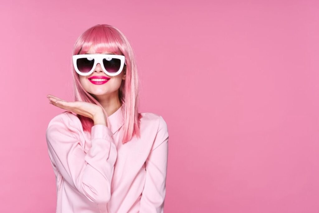 Pink hair Stylish girl wearing pink dress and glasses.