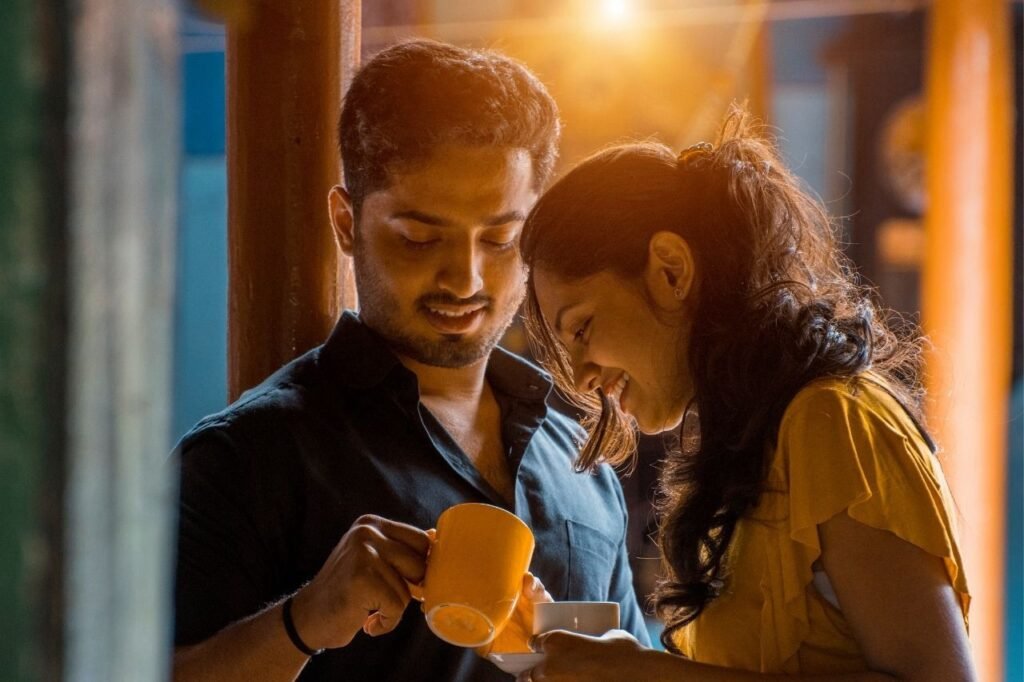 Happy couple sharing coffee or tea