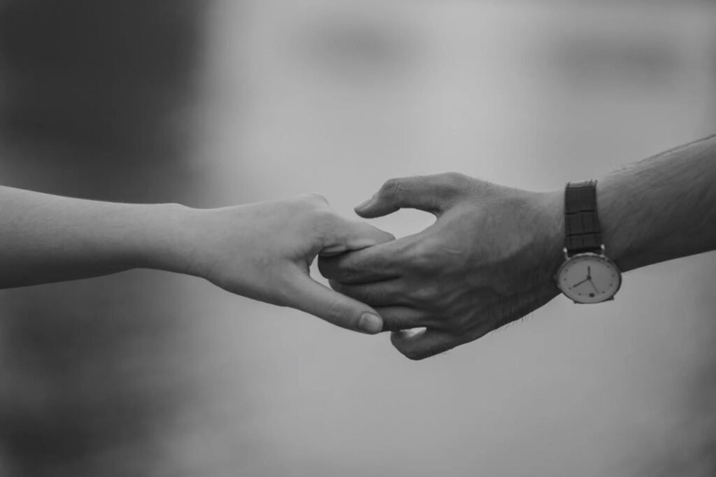 Couple holding each other hands